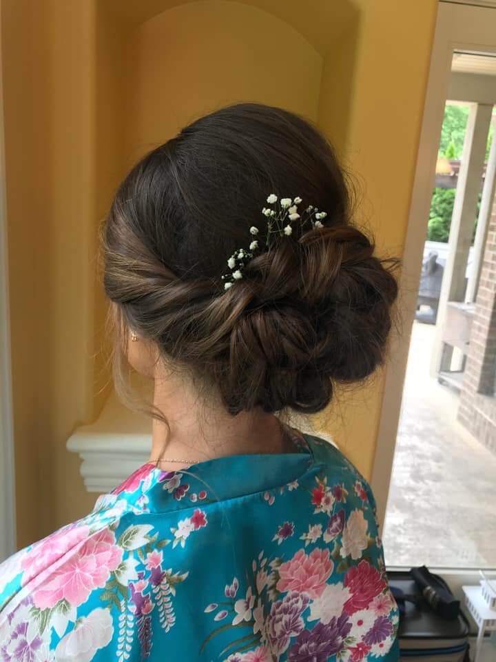 updo hairstyle with flowers in bun