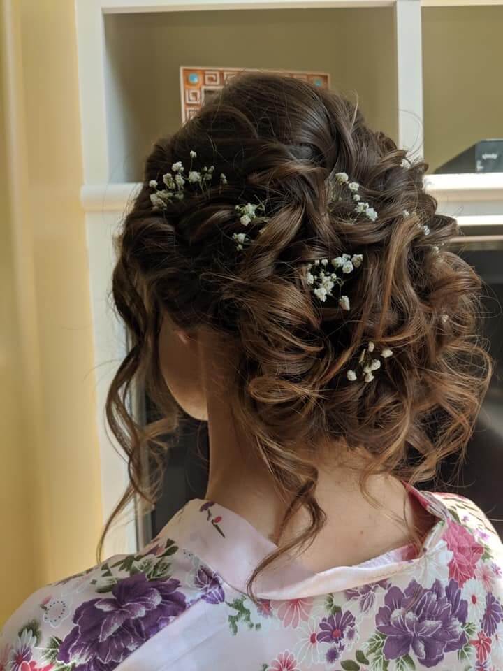 updo hairstyle with flowers in hair