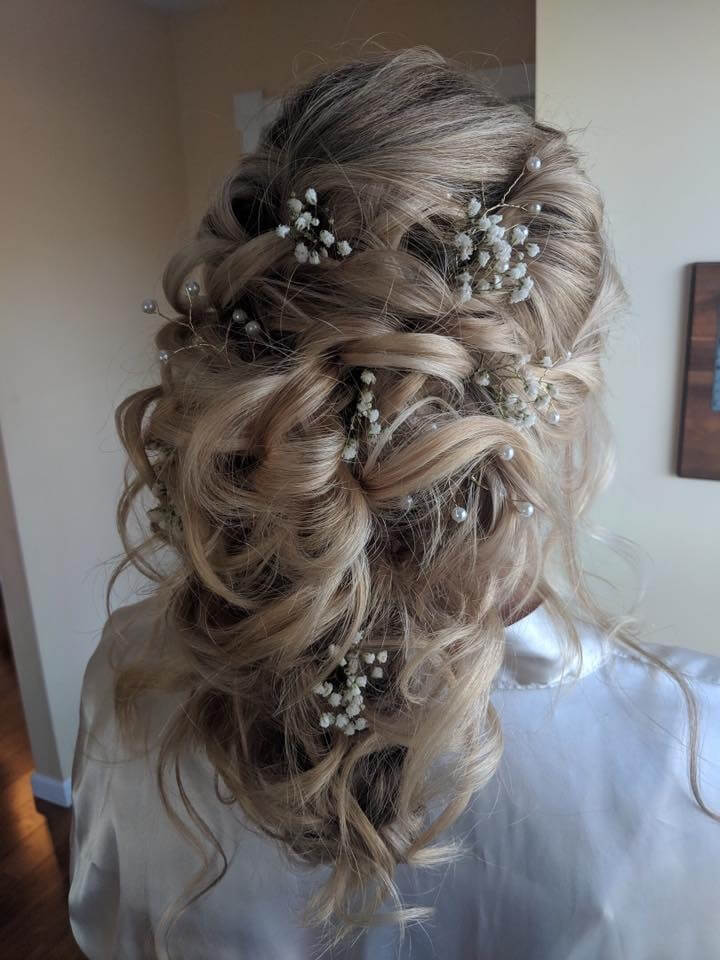 wedding hairstyle with flowers in her hair